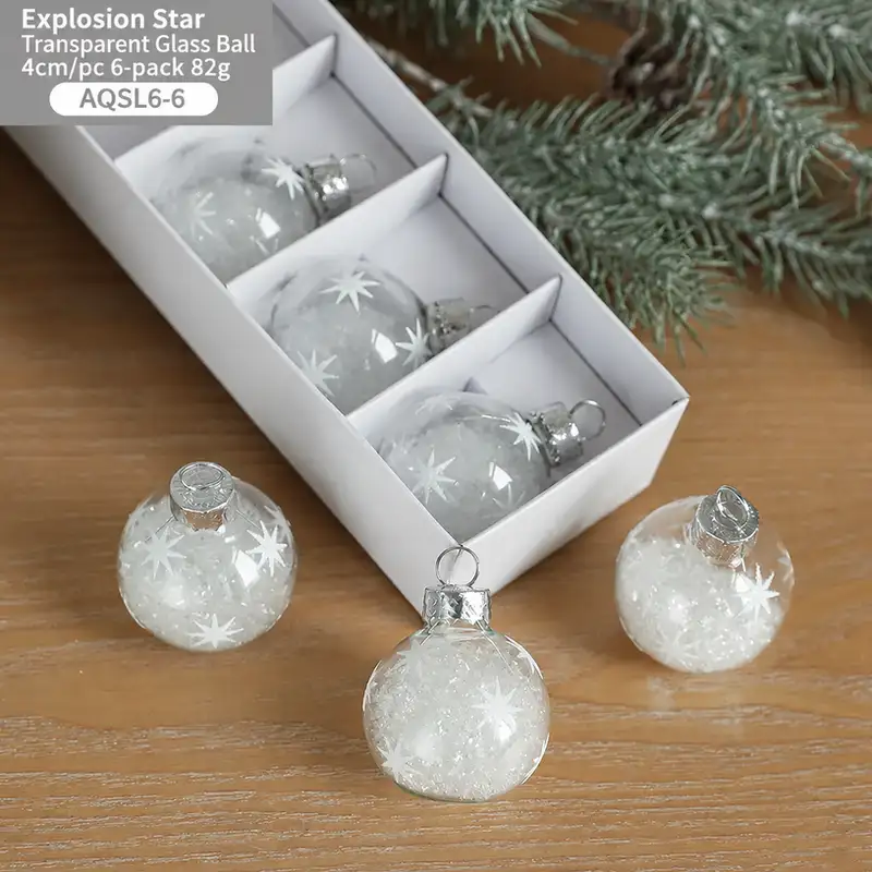 Boxed transparent glass Christmas ornaments with snowflake sequins