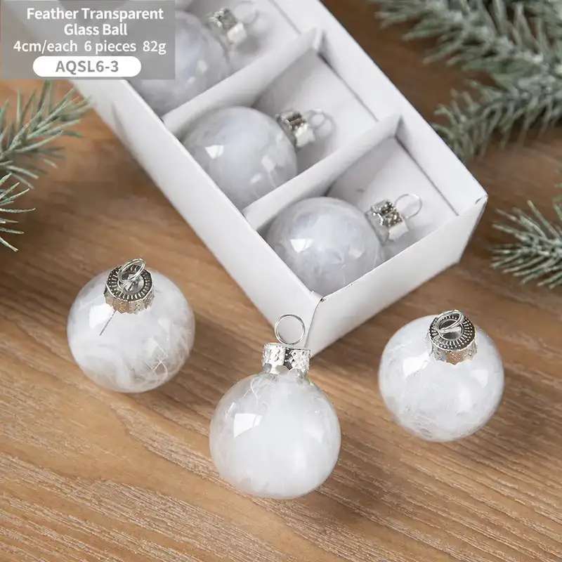 Boxed transparent glass Christmas ornaments with snowflake sequins
