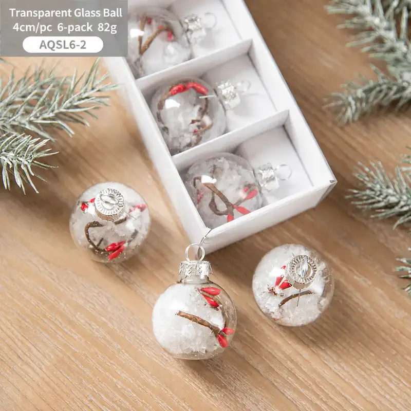 Boxed transparent glass Christmas ornaments with snowflake sequins