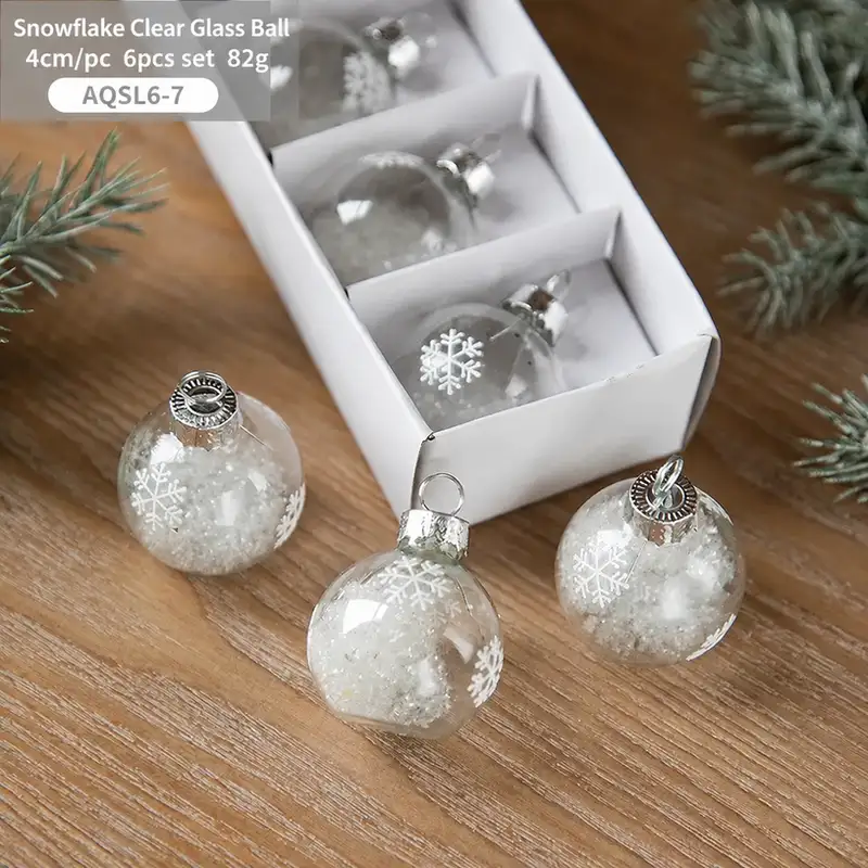 Boxed transparent glass Christmas ornaments with snowflake sequins