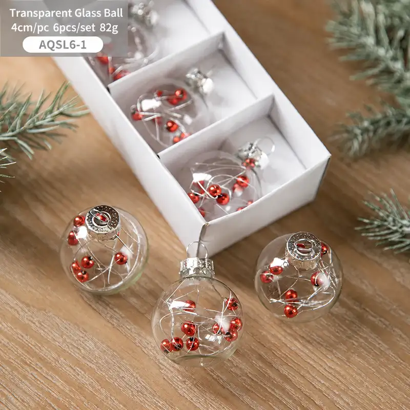 Boxed transparent glass Christmas ornaments with snowflake sequins