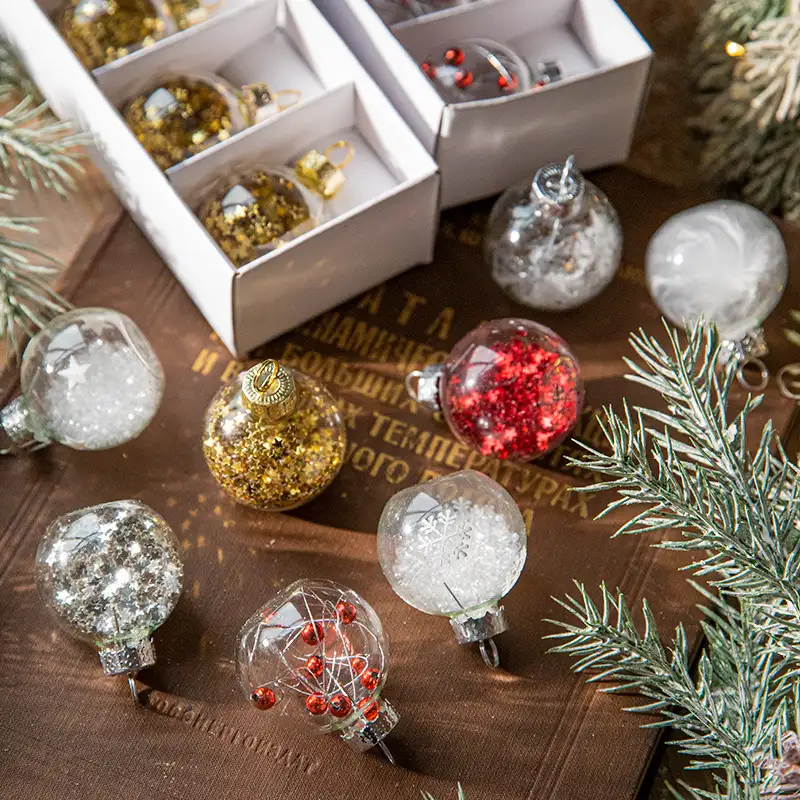 Boxed transparent glass Christmas ornaments with snowflake sequins