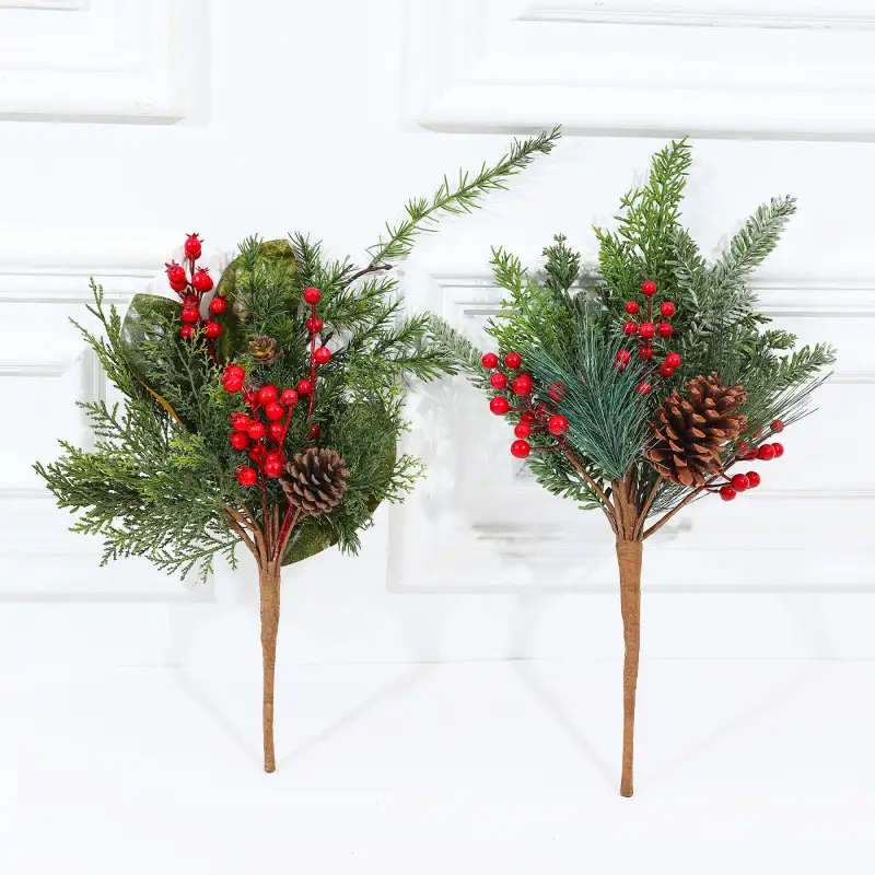 Artificial cedar branch decoration with red berries and pine cones
