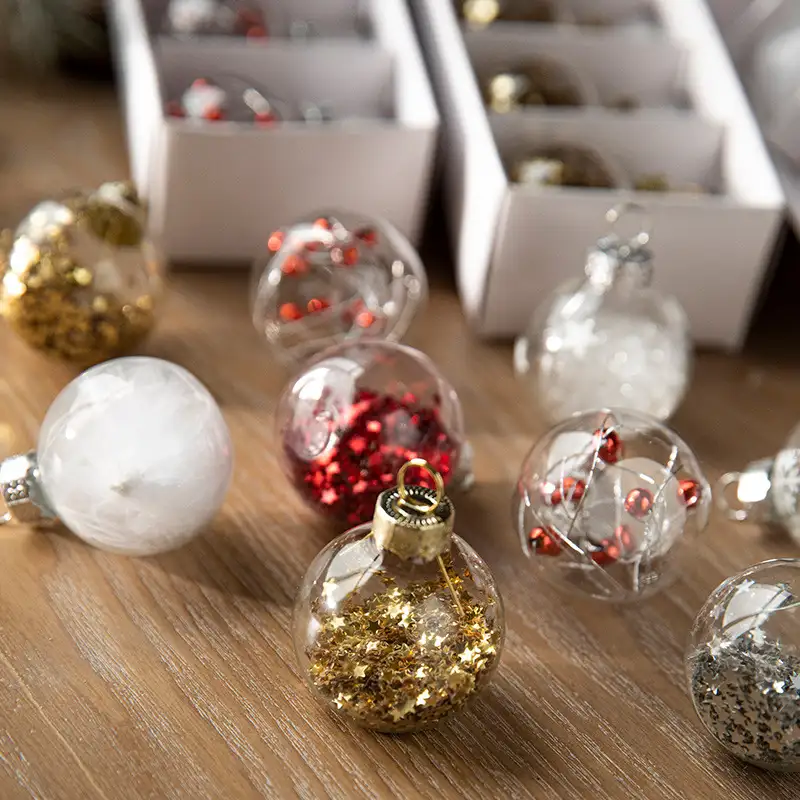 Boxed transparent glass Christmas ornaments with snowflake sequins