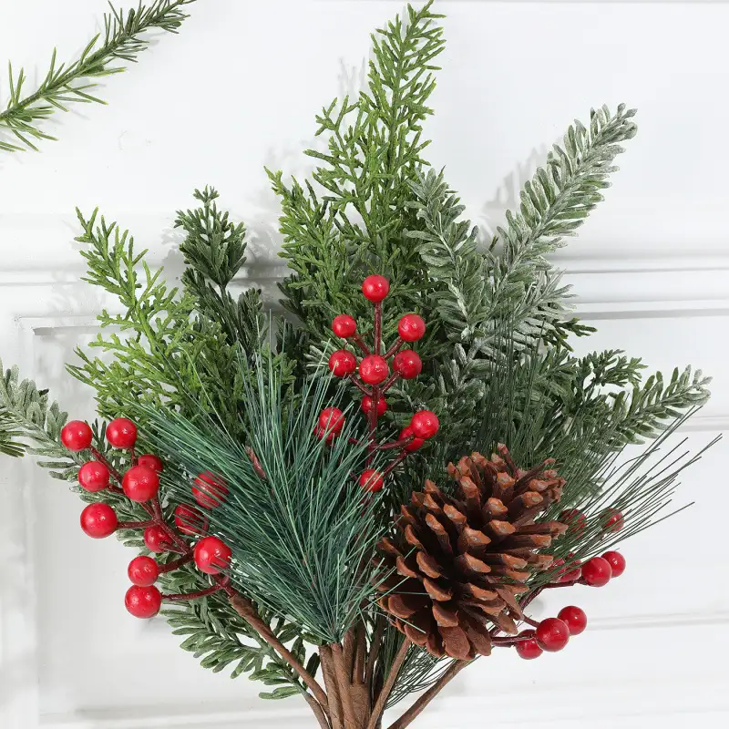 Artificial cedar branch decoration with red berries and pine cones