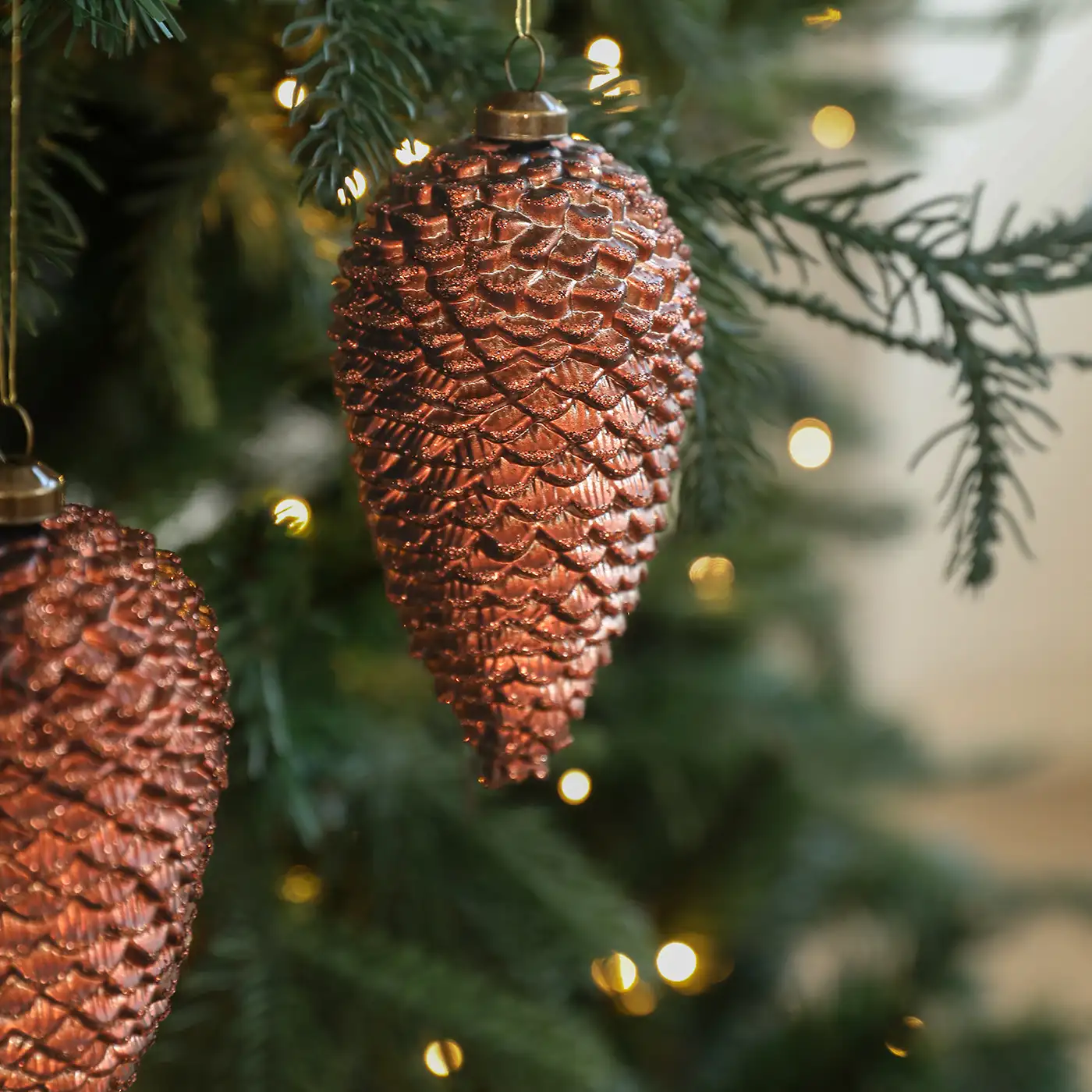 Colored plastic glitter-coated pinecone and acorn Christmas tree ornaments