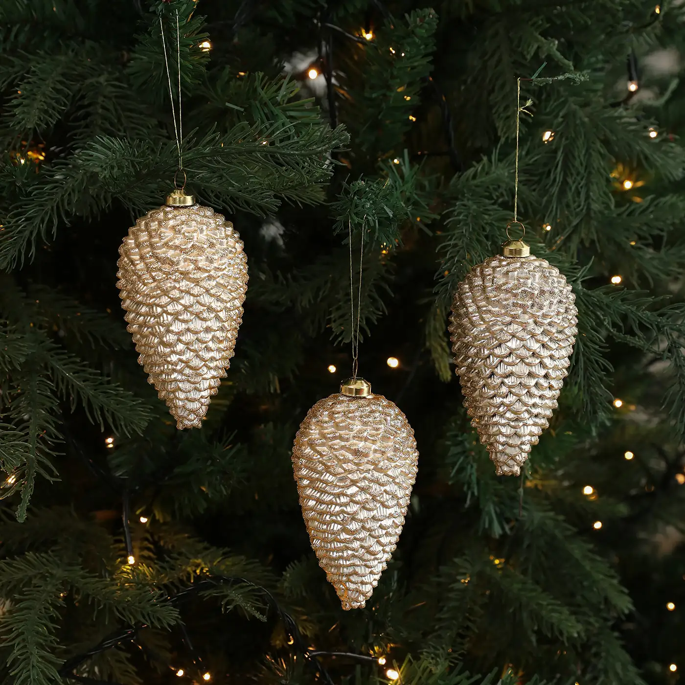 Colored plastic glitter-coated pinecone and acorn Christmas tree ornaments